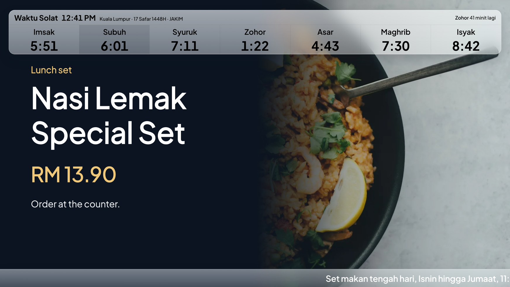 A shop TV showing a Malaysian cafe lunch set with the price in ringgit and the day's prayer times.